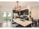 Modern kitchen featuring an island with seating and stainless steel appliances at 2426 S Acoma St, Denver, CO 80223
