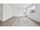 Spacious living area featuring light wood floors, recessed lighting, and a large window with natural light at 45921 Wood Thrush Ave, Bennett, CO 80102
