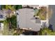 Aerial view of the home's roof, surrounding landscaping, deck, and backyard patio at 13131 Pennsylvania St, Thornton, CO 80241