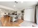 Large kitchen with island seating, stainless appliances, and easy access to the dining area at 13131 Pennsylvania St, Thornton, CO 80241
