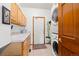 Practical laundry room with cabinets, sink, washer, and dryer, offering convenience and storage space at 13131 Pennsylvania St, Thornton, CO 80241