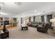 Open-concept living room with a large sectional sofa and lots of space for relaxing at 13131 Pennsylvania St, Thornton, CO 80241