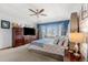 Serene main bedroom featuring a bay window, ample closet space, and stylish furnishings at 13131 Pennsylvania St, Thornton, CO 80241