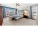Stylish main bedroom featuring a decorative wall, large bay window, and elegant furnishings for a serene retreat at 13131 Pennsylvania St, Thornton, CO 80241