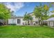 Spacious backyard with well-maintained lawn and a cozy patio area perfect for outdoor entertaining at 10972 Fairfax Ct, Thornton, CO 80233