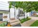Inviting front entrance with a concrete walkway and steps leading to the front door at 10972 Fairfax Ct, Thornton, CO 80233