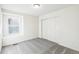 Well-lit bedroom with neutral carpet and sliding door closet at 13372 E 110Th Way, Commerce City, CO 80022