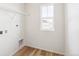 Laundry room with shelving and vinyl flooring at 13372 E 110Th Way, Commerce City, CO 80022