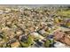 Expansive aerial view showcasing the neighborhood with tree-lined streets and single-Gathering homes at 3778 S Hooker St, Englewood, CO 80110