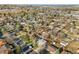 Wide aerial shot of a neighborhood filled with mature trees and diverse housing options at 3778 S Hooker St, Englewood, CO 80110