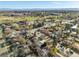 Aerial view of homes in a neighborhood near a green space with mountain views in the distance at 3778 S Hooker St, Englewood, CO 80110