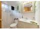 Bathroom with a white vanity, medicine cabinet, and tub/shower combination needs updates and maintenance for a fresh look at 3778 S Hooker St, Englewood, CO 80110