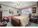 Bedroom featuring a ceiling fan and decorative wallpaper accents at 3778 S Hooker St, Englewood, CO 80110