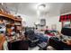 Bedroom with a book shelf, chair, light fixture, bed, and dark trim needs renovation and updates to enhance its appeal at 3778 S Hooker St, Englewood, CO 80110