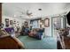 View of a living room with a ceiling fan and an exterior door at 3778 S Hooker St, Englewood, CO 80110