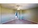 This is a bedroom with carpeted floors, neutral-colored walls, and natural light coming through the window at 4487 S Alkire St, Morrison, CO 80465