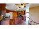 Cozy kitchen with wooden cabinetry, center island, hardwood floors and ceiling fan lighting at 4487 S Alkire St, Morrison, CO 80465