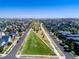 Aerial view of neighborhood with central green space at 4937 Tamarac St, Denver, CO 80238