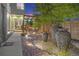 Landscaped backyard with water feature and seating area at 4937 Tamarac St, Denver, CO 80238