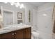 Clean bathroom with tub shower and vanity at 4937 Tamarac St, Denver, CO 80238