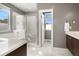 Modern bathroom with soaking tub, walk-in shower, and double vanity at 4937 Tamarac St, Denver, CO 80238