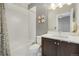 Clean bathroom with tub shower, vanity, and toilet at 4937 Tamarac St, Denver, CO 80238