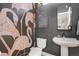 Stylish powder room with flamingo wallpaper and modern vanity at 4937 Tamarac St, Denver, CO 80238