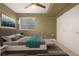 Spacious bedroom featuring a plush bed, stylish decor, and built-in closet at 4937 Tamarac St, Denver, CO 80238