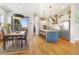 Modern dining room with hardwood floors and a wood dining table at 4937 Tamarac St, Denver, CO 80238