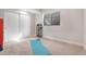 Basement exercise room with yoga mat and storage at 4937 Tamarac St, Denver, CO 80238