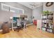 Bright home office features built-in shelving and a large desk at 4937 Tamarac St, Denver, CO 80238