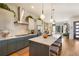 Modern kitchen with blue cabinets, white countertops, and stainless steel appliances at 4937 Tamarac St, Denver, CO 80238