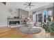 Bright living room with a fireplace and hardwood floors at 4937 Tamarac St, Denver, CO 80238