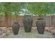 Serene backyard water feature with three tiered stone water pots at 4937 Tamarac St, Denver, CO 80238