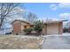 Charming two-story brick home with attached garage and mature trees at 6047 Vivian Ct, Arvada, CO 80004