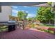 Inviting back deck perfect for outdoor entertaining with lush greenery at 8761 Cloverleaf Cir, Parker, CO 80134