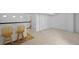 Finished basement with bar area, neutral carpeting, and ample space at 8761 Cloverleaf Cir, Parker, CO 80134