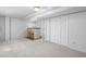 Finished basement featuring a bar, neutral carpeting, and large storage area at 8761 Cloverleaf Cir, Parker, CO 80134