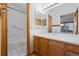 Neat bathroom with tiled shower/tub, vanity with sink, and mirrored medicine cabinet at 8761 Cloverleaf Cir, Parker, CO 80134