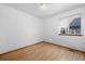 Bright bedroom with hardwood floors and natural light from a window at 8761 Cloverleaf Cir, Parker, CO 80134