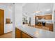 Open kitchen featuring wooden cabinets, stainless steel appliances, and eat in kitchen dining area at 8761 Cloverleaf Cir, Parker, CO 80134