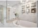 Stunning bathroom features a soaking tub, glass enclosed shower and modern lighting fixtures at 2001 Lincoln St # 2923, Denver, CO 80202