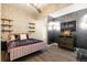 Contemporary bedroom with brick accent wall and unique lighting at 2001 Lincoln St # 2923, Denver, CO 80202