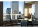 Modern dining room with city view, telescope, and contemporary decor at 2001 Lincoln St # 2923, Denver, CO 80202