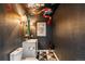 Stylish powder room with designer wallpaper and modern fixtures at 2001 Lincoln St # 2923, Denver, CO 80202