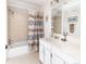 Bathroom featuring a shower-tub combo and a white vanity at 6964 S Olive Way, Centennial, CO 80112
