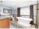 Bright bathroom features a soaking tub, shower, and granite vanity top at 6964 S Olive Way, Centennial, CO 80112