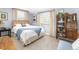 Comfortable bedroom features natural light and neutral decor at 6964 S Olive Way, Centennial, CO 80112