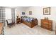Cozy bedroom with a twin bed, wooden furniture and decor at 6964 S Olive Way, Centennial, CO 80112