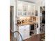 Built in serving area with marble countertops and a wine fridge at 6964 S Olive Way, Centennial, CO 80112